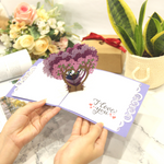 Load image into Gallery viewer, Kissing Couple on Purple Heart Wisteria Pop Up Card