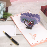 Load image into Gallery viewer, Kissing Couple on Purple Heart Wisteria Pop Up Card