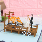 Load image into Gallery viewer, Romantic Bride &amp; Groom on the Quay Pop Up Card
